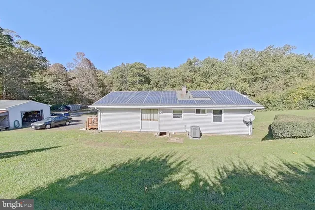 a view of a house with a big yard