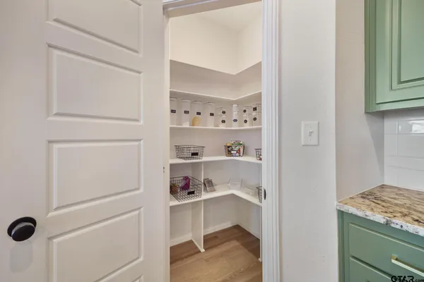 a view of a room with furniture window and wooden floor