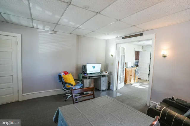 a bedroom with a bed and windows