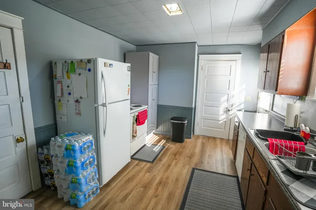 a kitchen with a sink cabinets and window