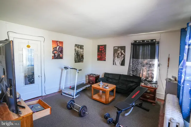 a room with furniture and a flat screen tv