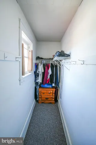 a room with furniture and a window