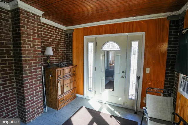 a view of a kitchen with furniture and a window