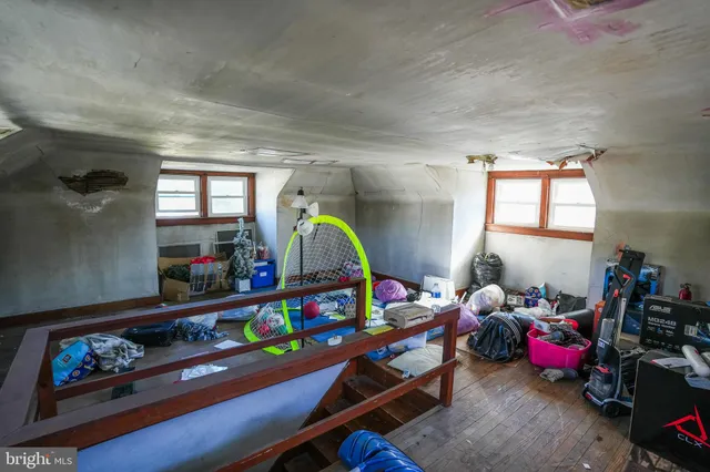 a kitchen with lots of clutter and cabinets