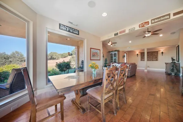 a view of a dining room with furniture window and outside view
