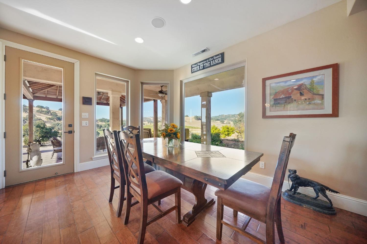 11195 Vintage Road Ione, CA 95640 - Photo 24 of 92 a dining room with furniture and wooden floor