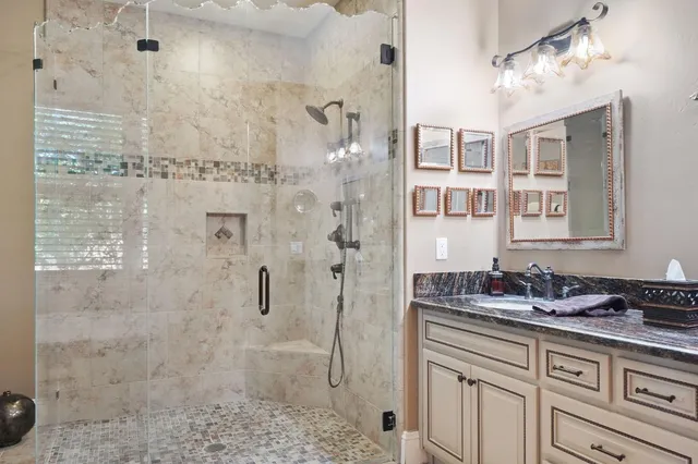 a bedroom with a large bed and a large window