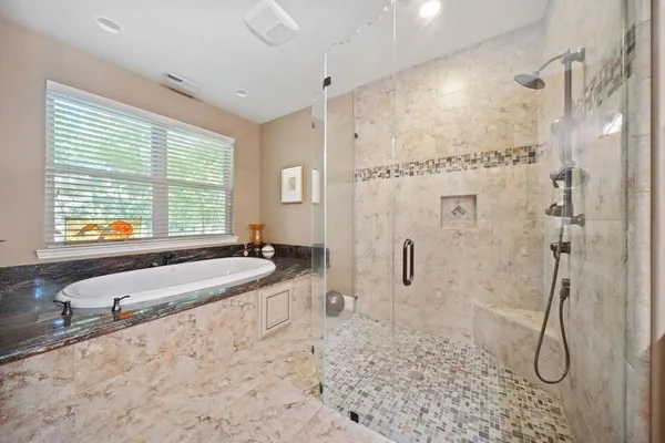 a bed room with a bed and a ceiling fan