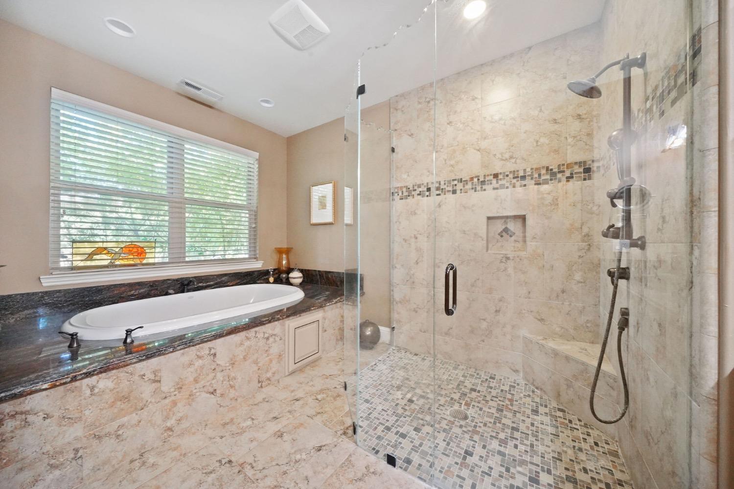 11195 Vintage Road Ione, CA 95640 - Photo 41 of 92 a bathroom with a granite countertop tub sink and glass door