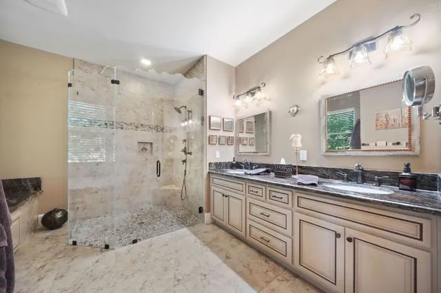 a bed room with a bed and a ceiling fan