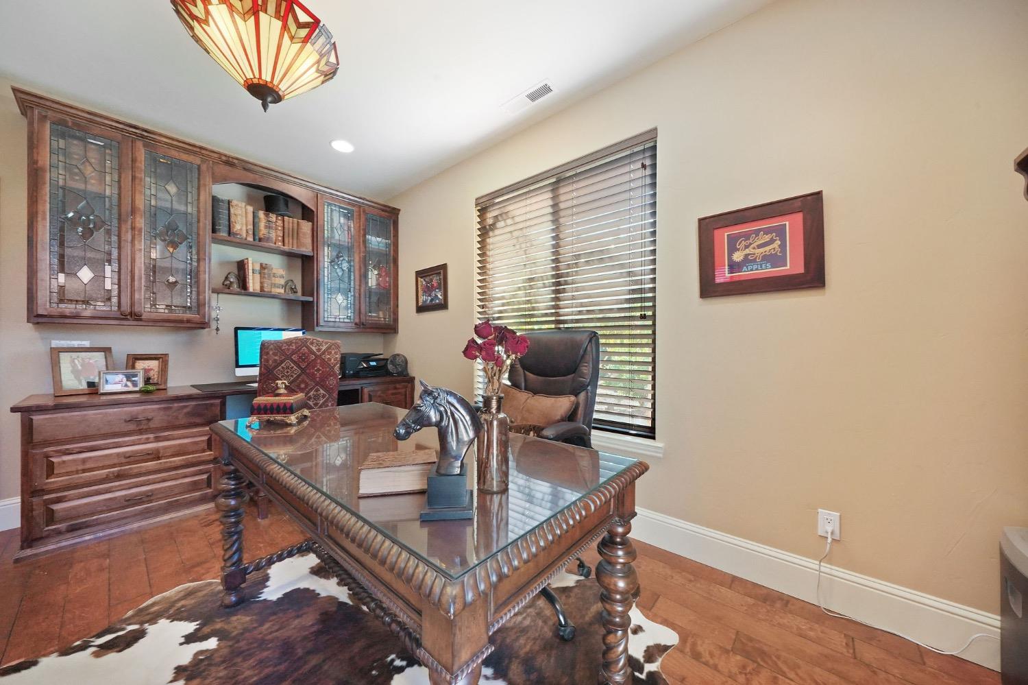 11195 Vintage Road Ione, CA 95640 - Photo 62 of 92 a view of a dining room with furniture and a potted plant