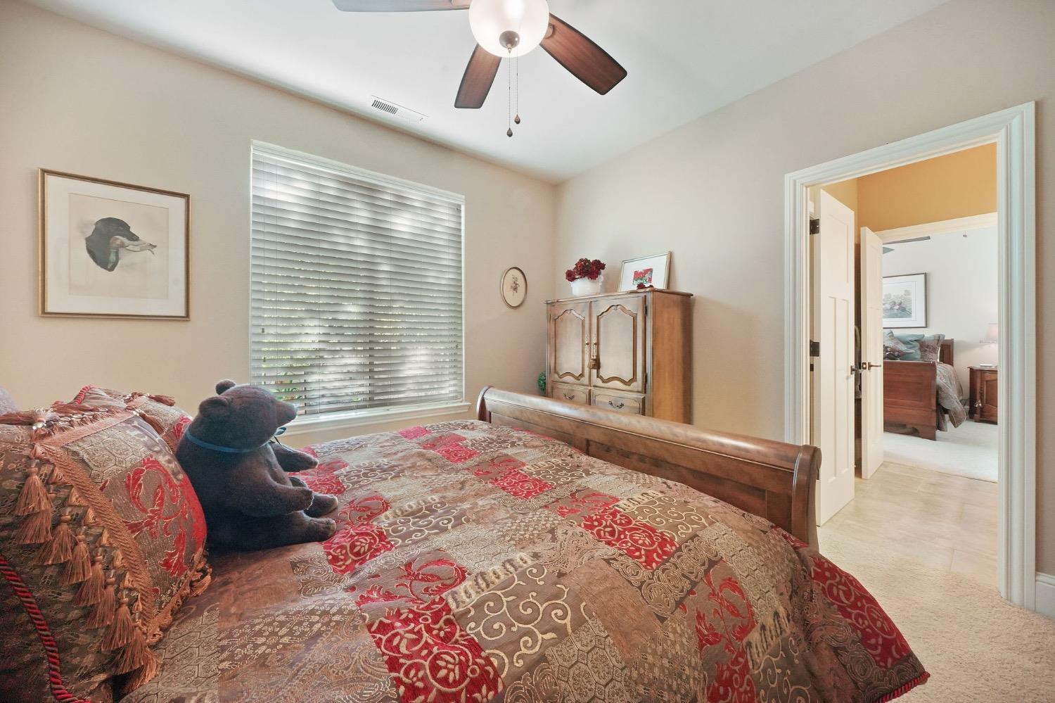 11195 Vintage Road Ione, CA 95640 - Photo 67 of 92 a bedroom with a large bed and a large window