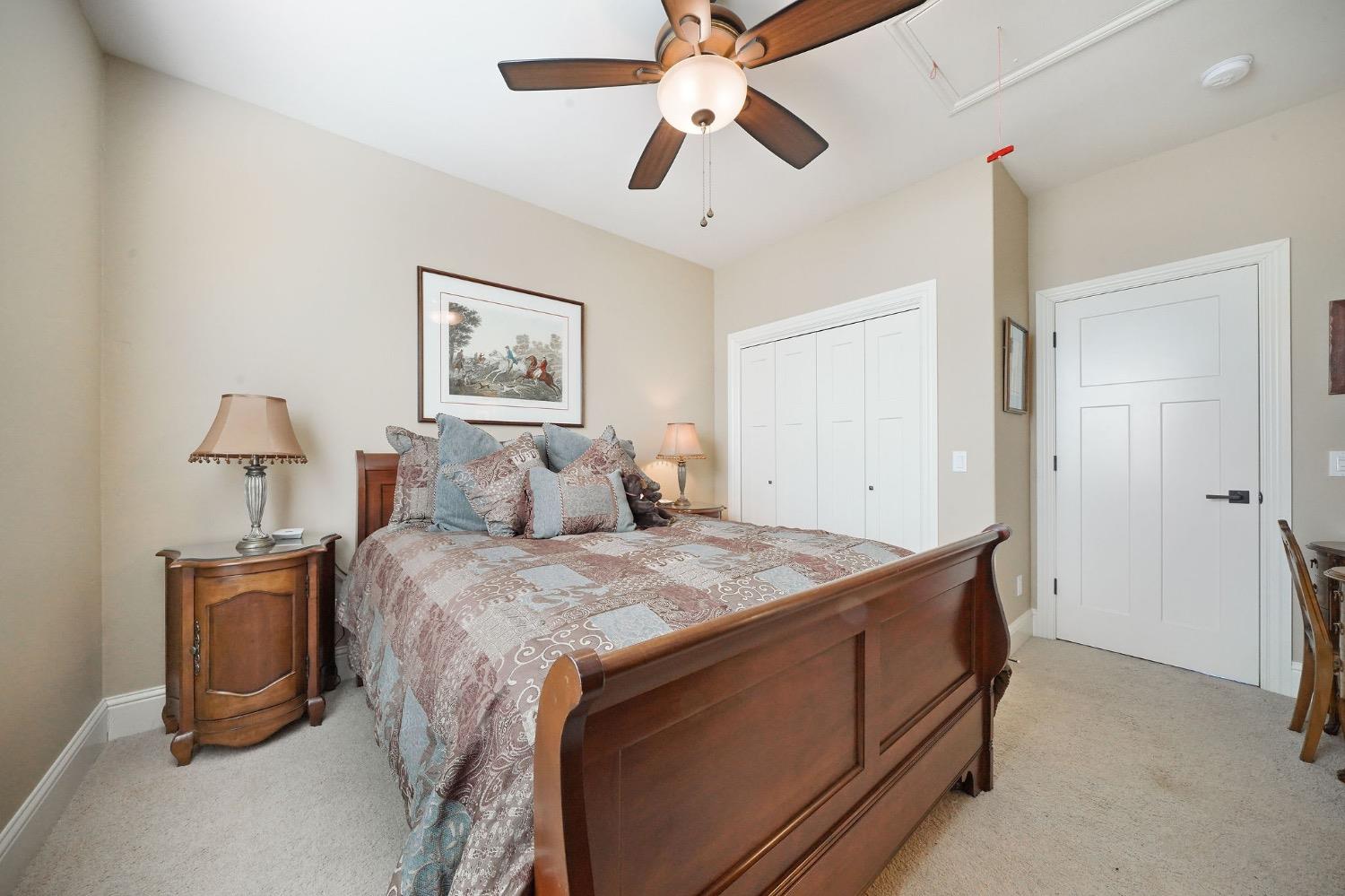 11195 Vintage Road Ione, CA 95640 - Photo 68 of 92 a bed room with a bed and a ceiling fan
