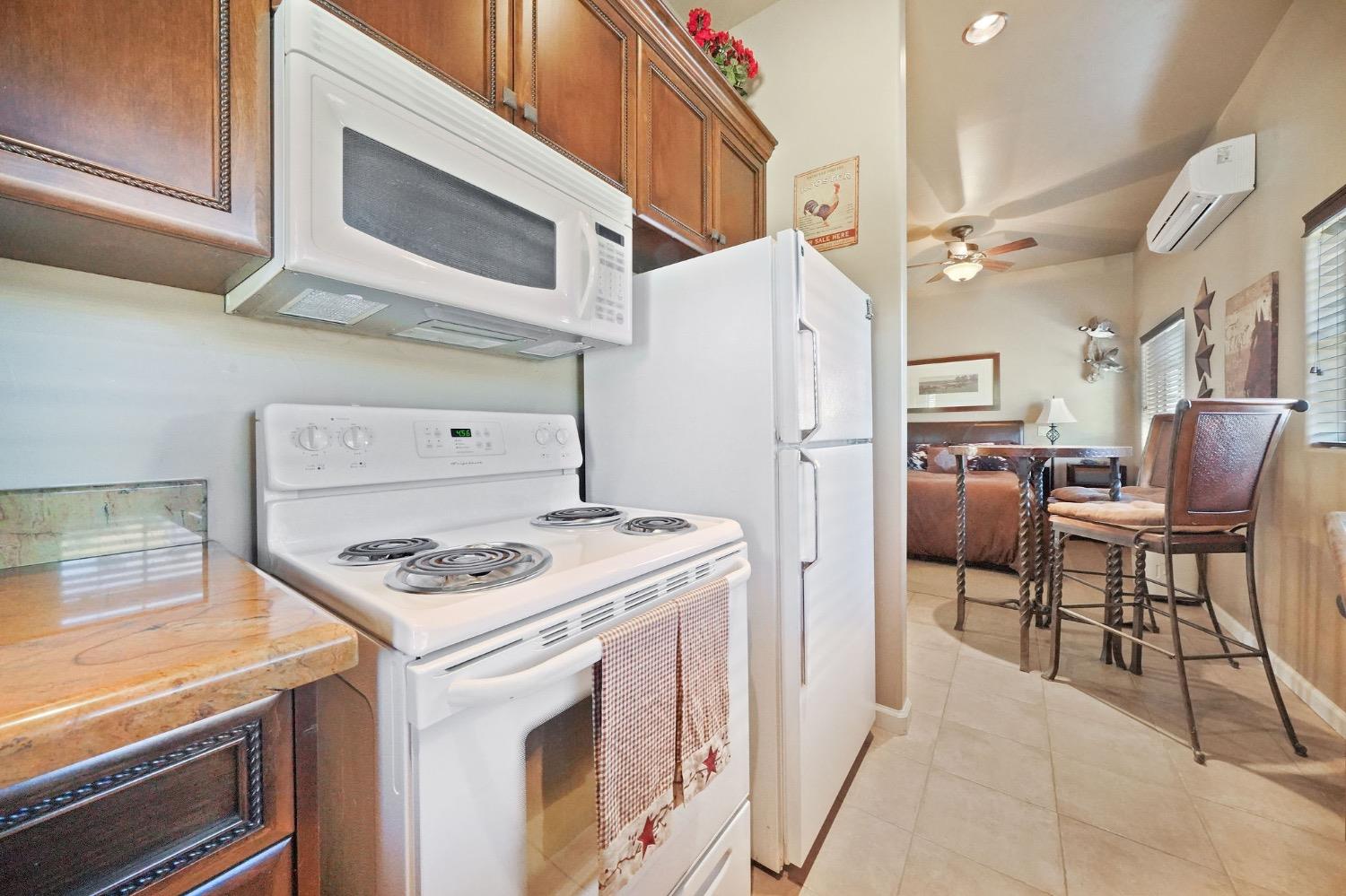 11195 Vintage Road Ione, CA 95640 - Photo 87 of 92 a kitchen with stainless steel appliances granite countertop a stove and a refrigerator