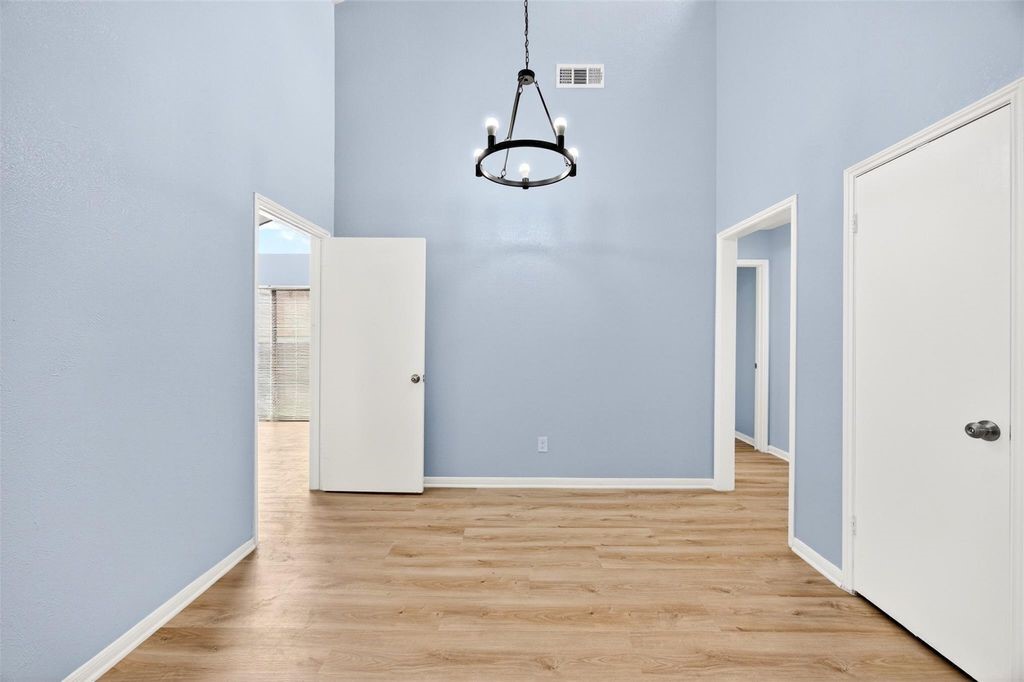 17 April Point Drive North Conroe, TX 77356 - Photo 35 of 42 a view of a room with wooden floor and white walls