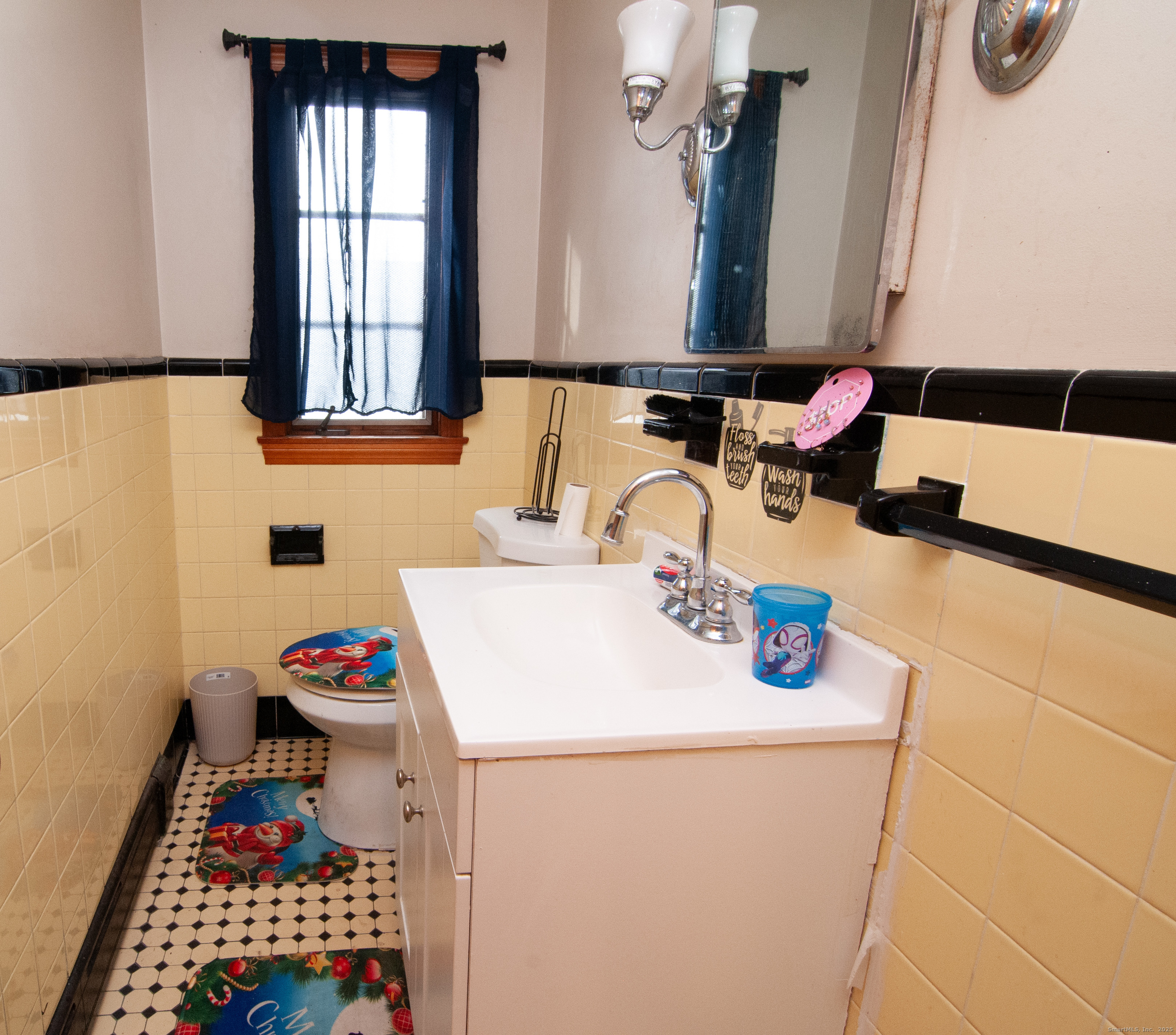 30 Adeline Avenue Bristol, CT 06010 - Photo 11 of 15 a bathroom with a sink and a mirror