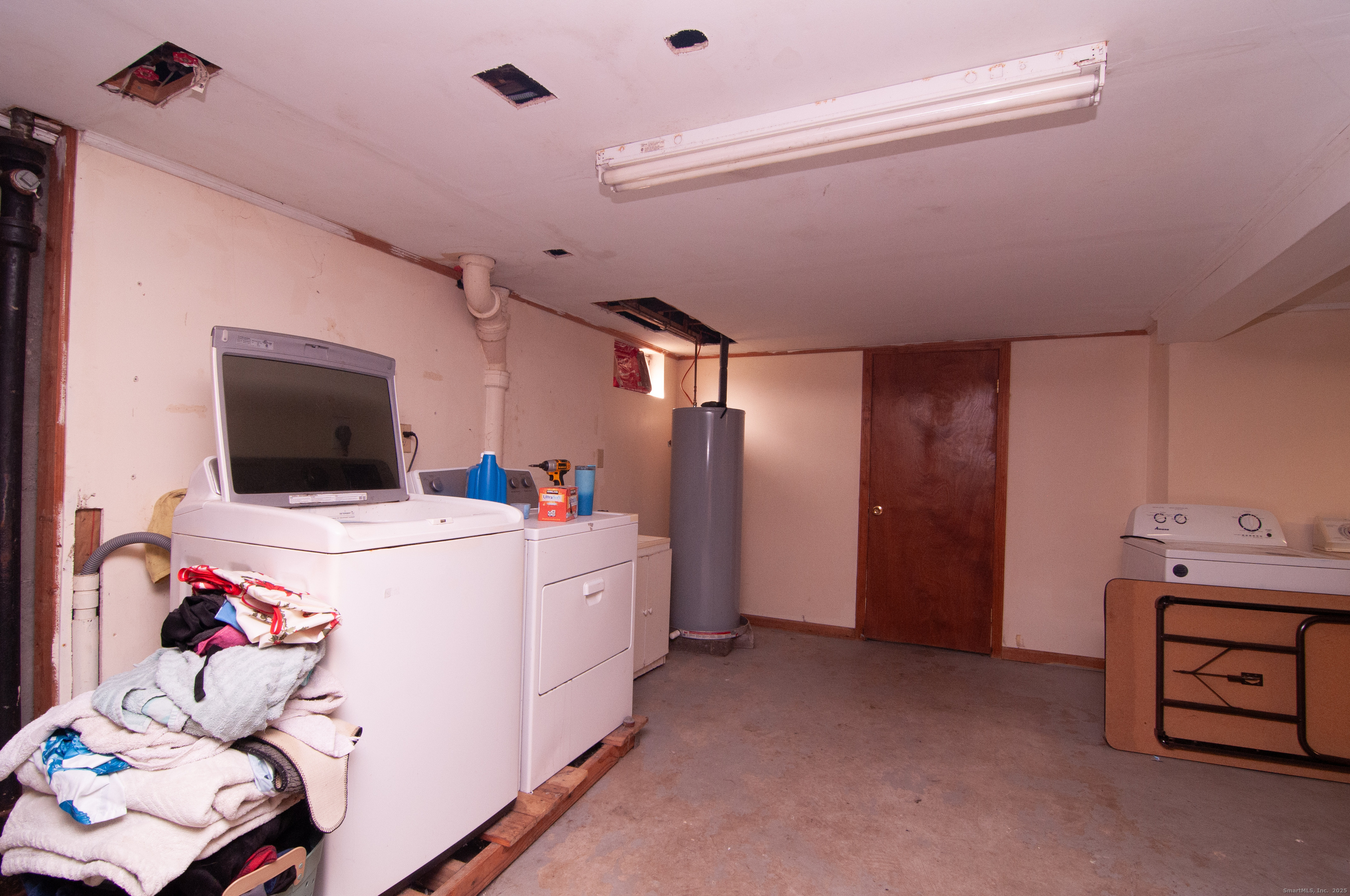 30 Adeline Avenue Bristol, CT 06010 - Photo 13 of 15 a room with furniture and a flat screen tv