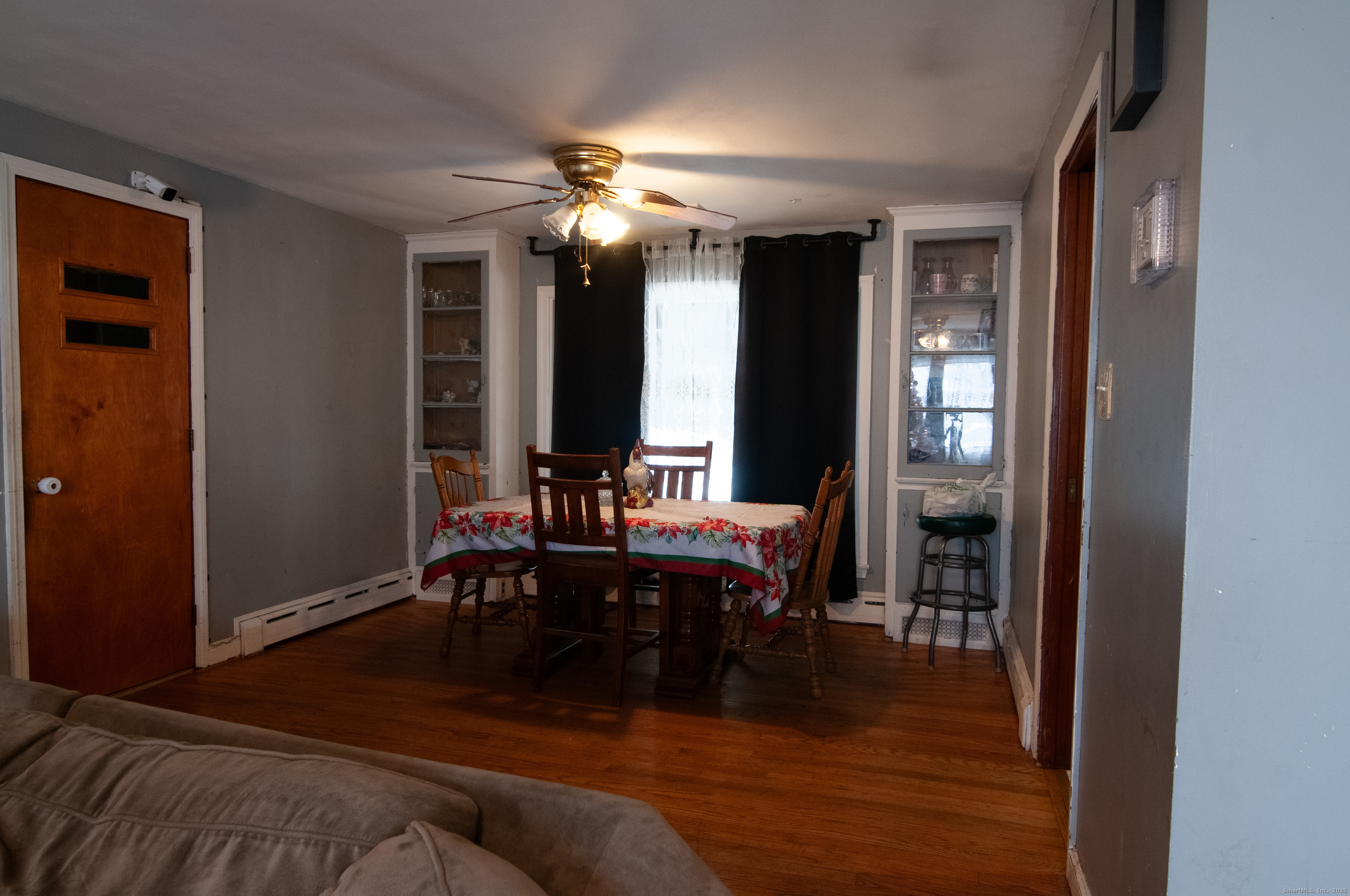 30 Adeline Avenue Bristol, CT 06010 - Photo 6 of 15 a living room with furniture a large window and a chandelier