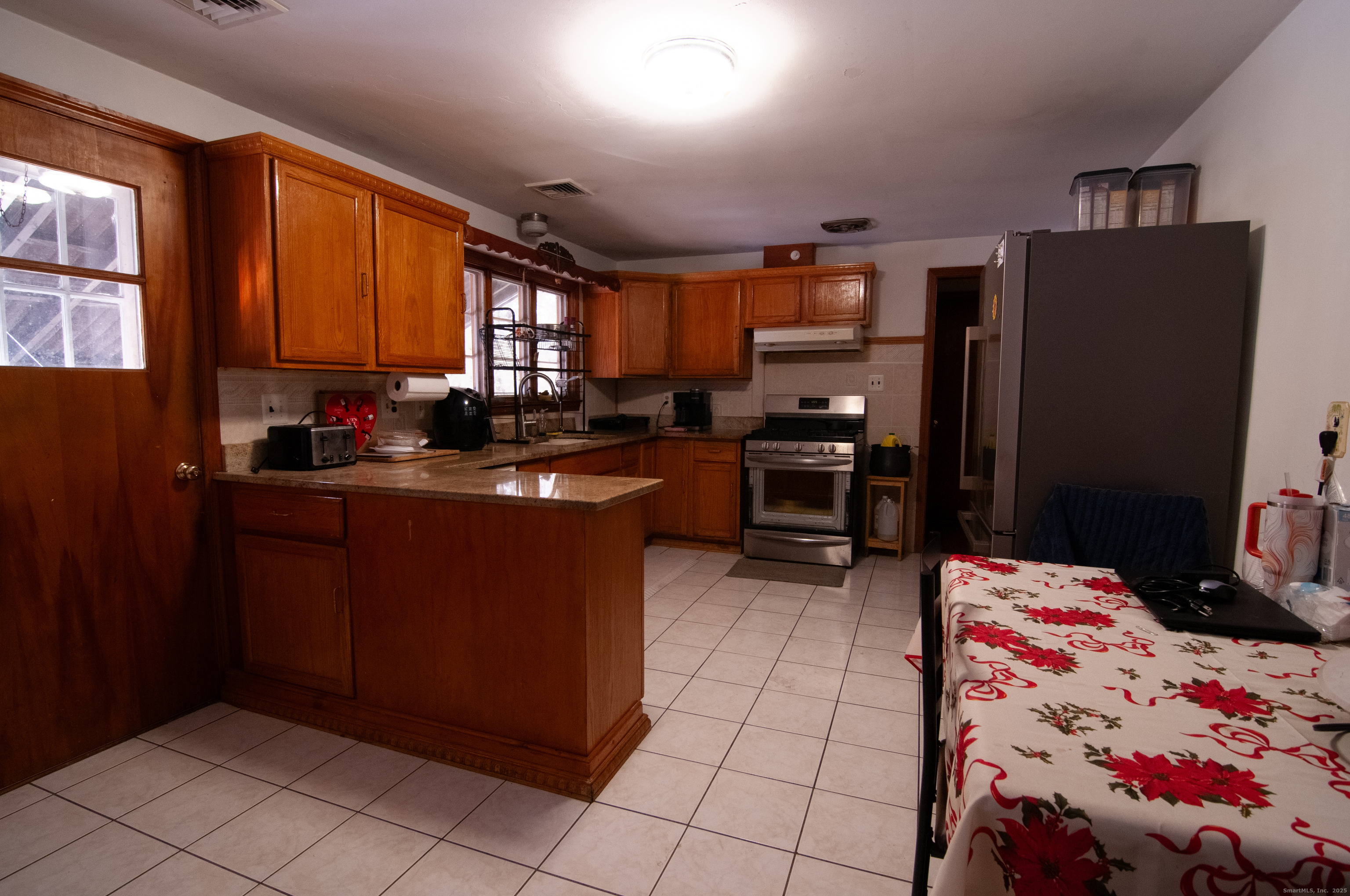 30 Adeline Avenue Bristol, CT 06010 - Photo 7 of 15 a kitchen with a sink refrigerator and cabinets