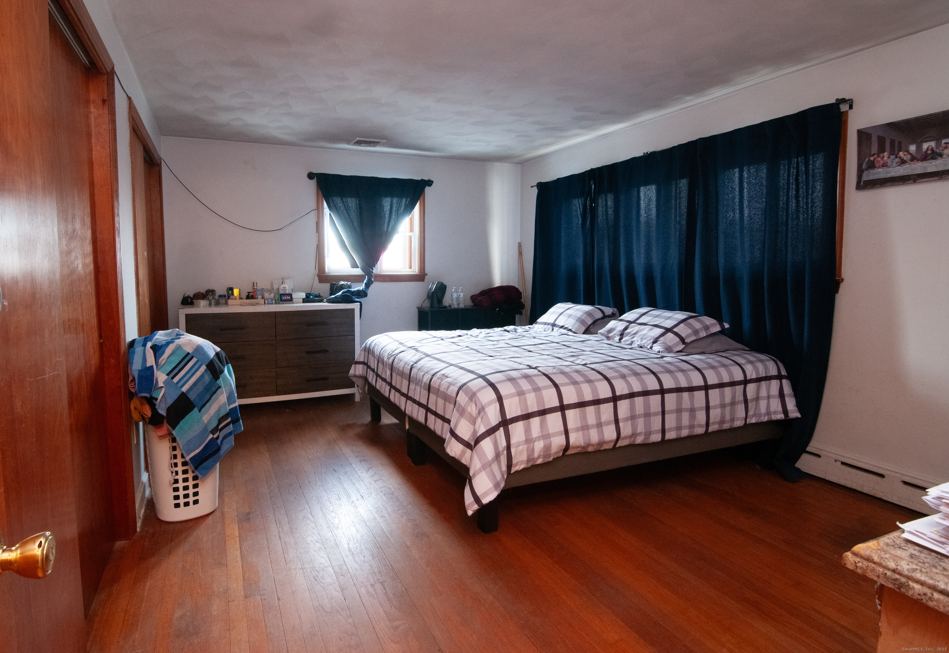 30 Adeline Avenue Bristol, CT 06010 - Photo 9 of 15 a bedroom with a bed and wooden floor