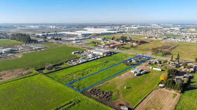 an aerial view of a pool a yard swimming pool and outdoor seating