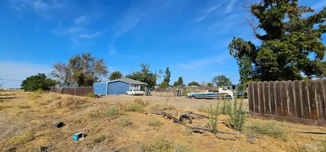 a view of a lake with a house in the background