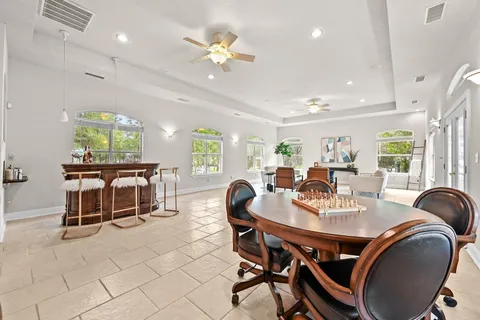 a dining room with furniture and window