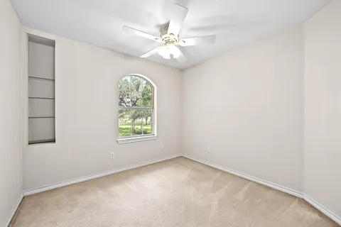 a bathroom with a sink toilet and a mirror