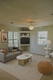 a view of a dining room with furniture and window