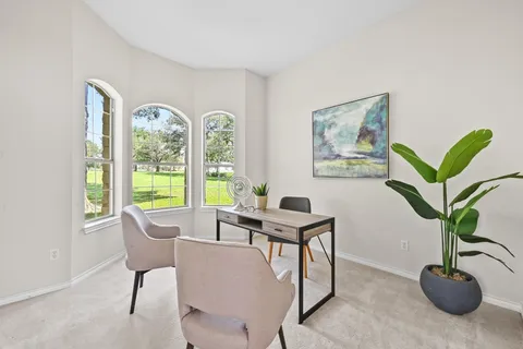 a view of a livingroom with furniture and a potted plant