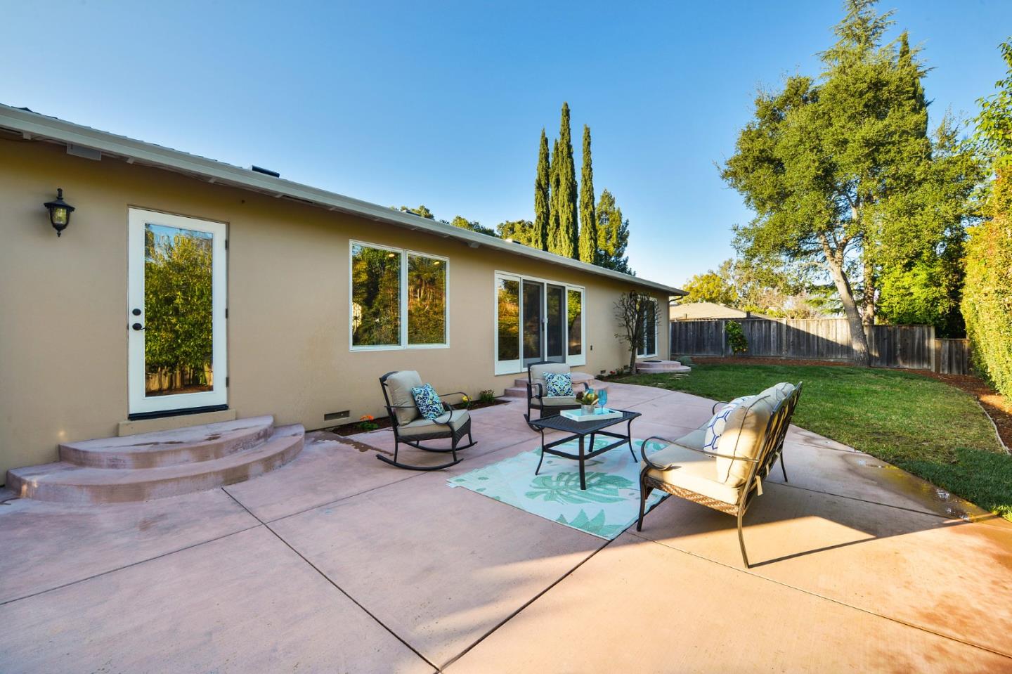 117 Worcester Loop Los Gatos, CA 95030 - Photo 27 of 47 a backyard of a house with table and chairs