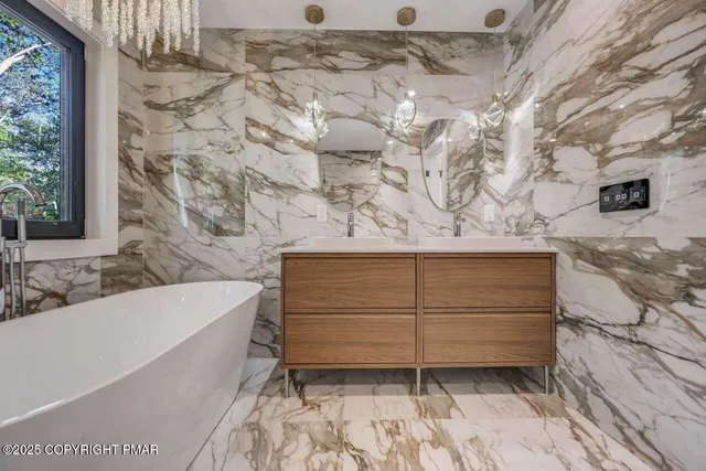 a bathroom with a bathtub and shower