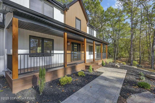a front view of a house with a porch