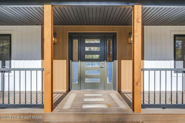 a view of door with wooden floor