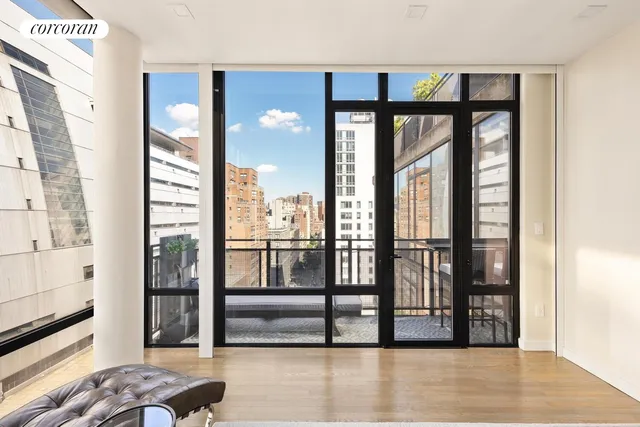 a spacious bedroom with a large bed and a large window