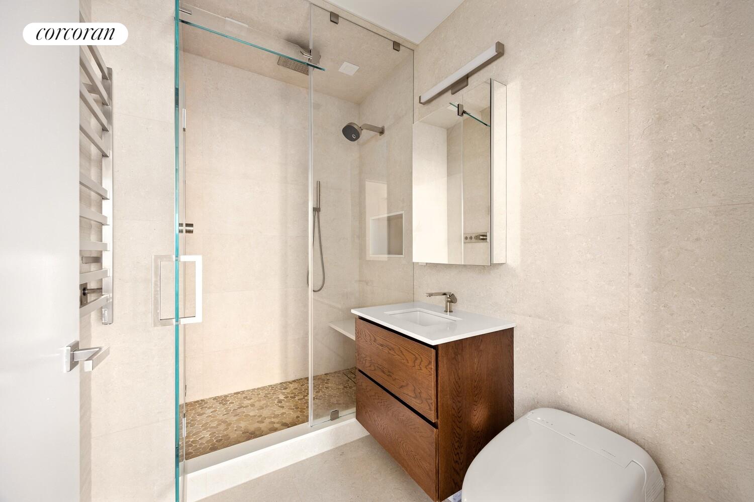 148 East 24th Street, Unit 15A Manhattan, NY 10010 - Photo 8 of 14 a bathroom with a toilet sink and shower