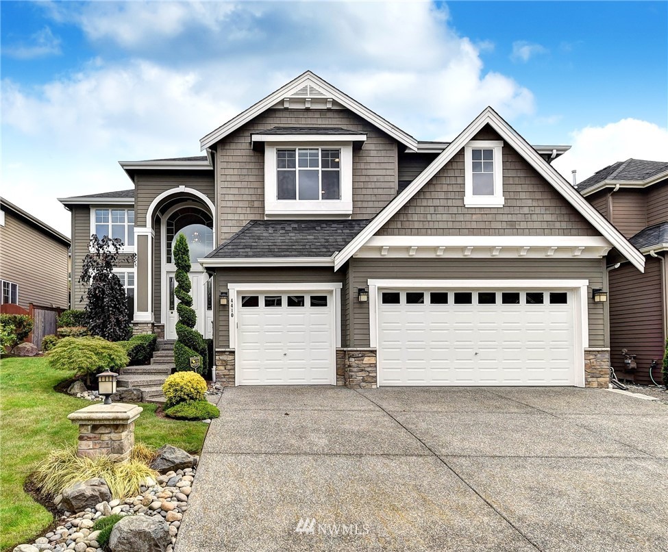 4410 220th Street Southeast Bothell, WA 98021 - Photo 1 of 28 front view of a house with a yard