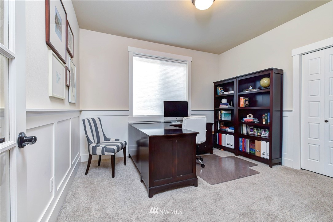 4410 220th Street Southeast Bothell, WA 98021 - Photo 14 of 28 a view of a workspace with furniture and a window