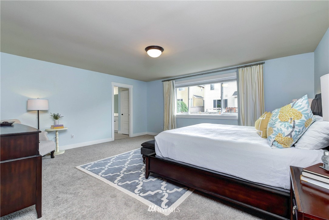 4410 220th Street Southeast Bothell, WA 98021 - Photo 18 of 28 a bedroom with a bed and window