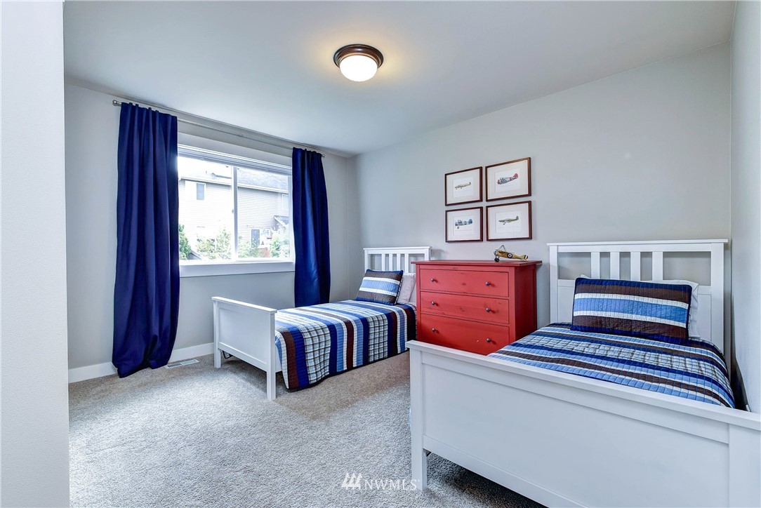 4410 220th Street Southeast Bothell, WA 98021 - Photo 22 of 28 a bed room with furniture and window