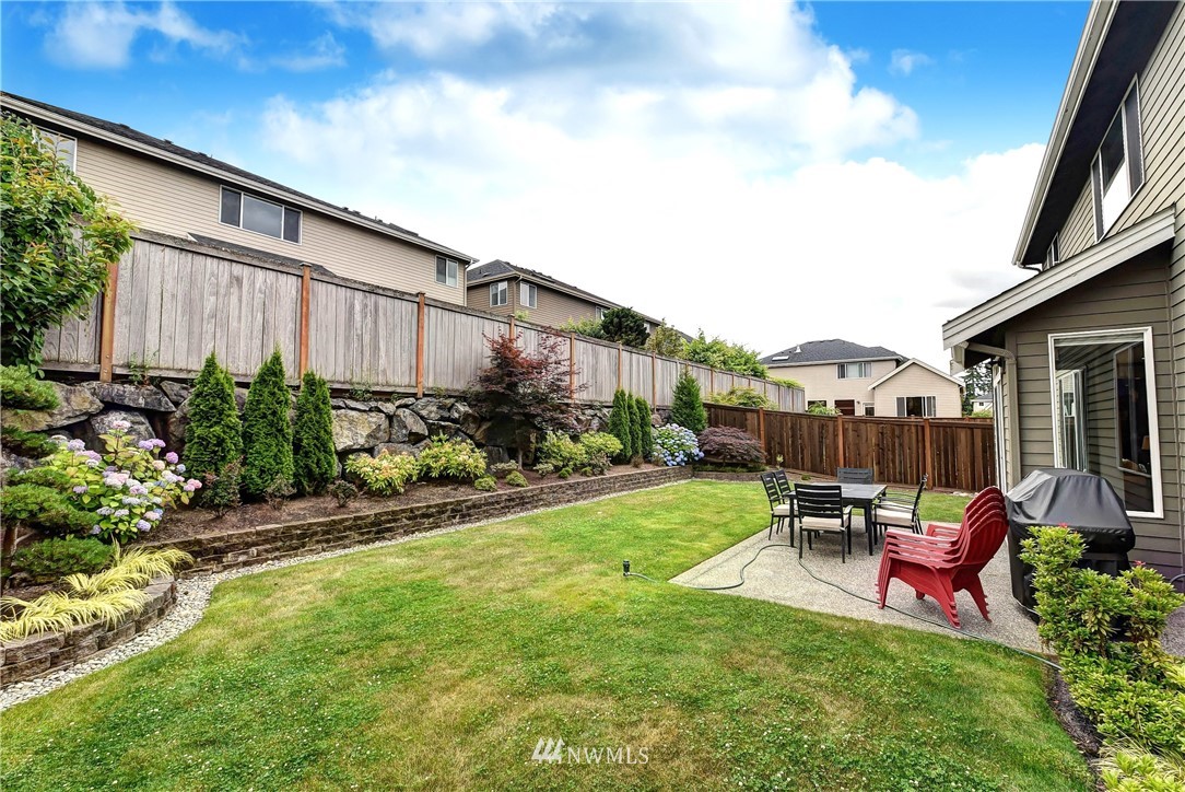 4410 220th Street Southeast Bothell, WA 98021 - Photo 28 of 28 a view of backyard with patio and outdoor seating