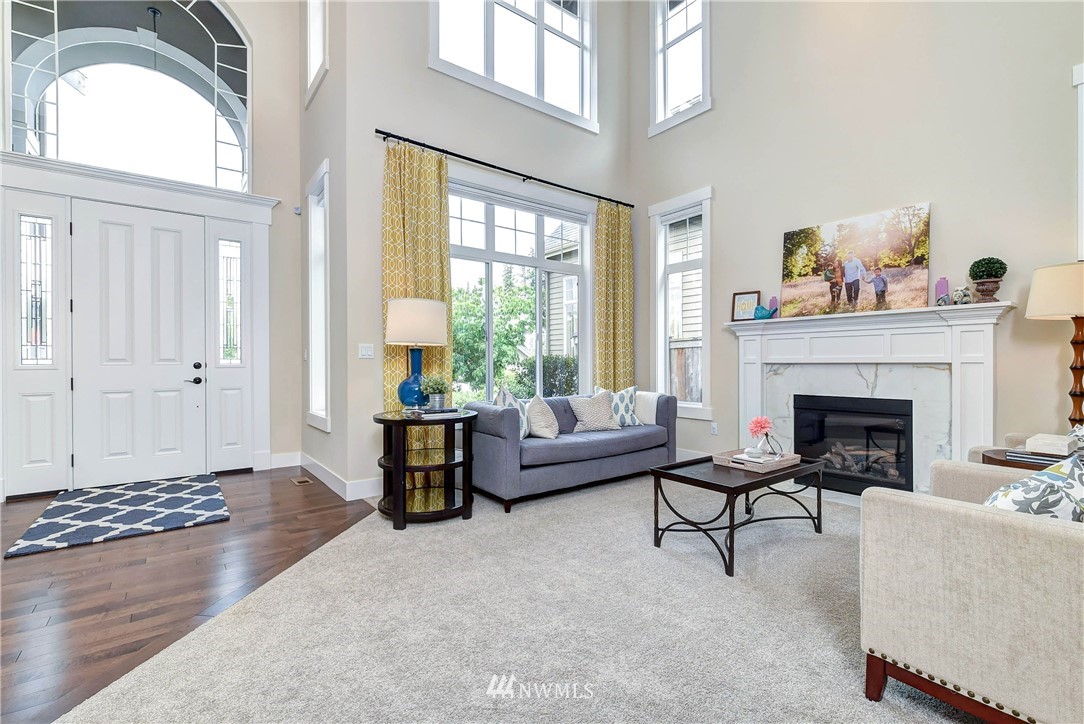 4410 220th Street Southeast Bothell, WA 98021 - Photo 5 of 28 a living room with furniture and a fireplace