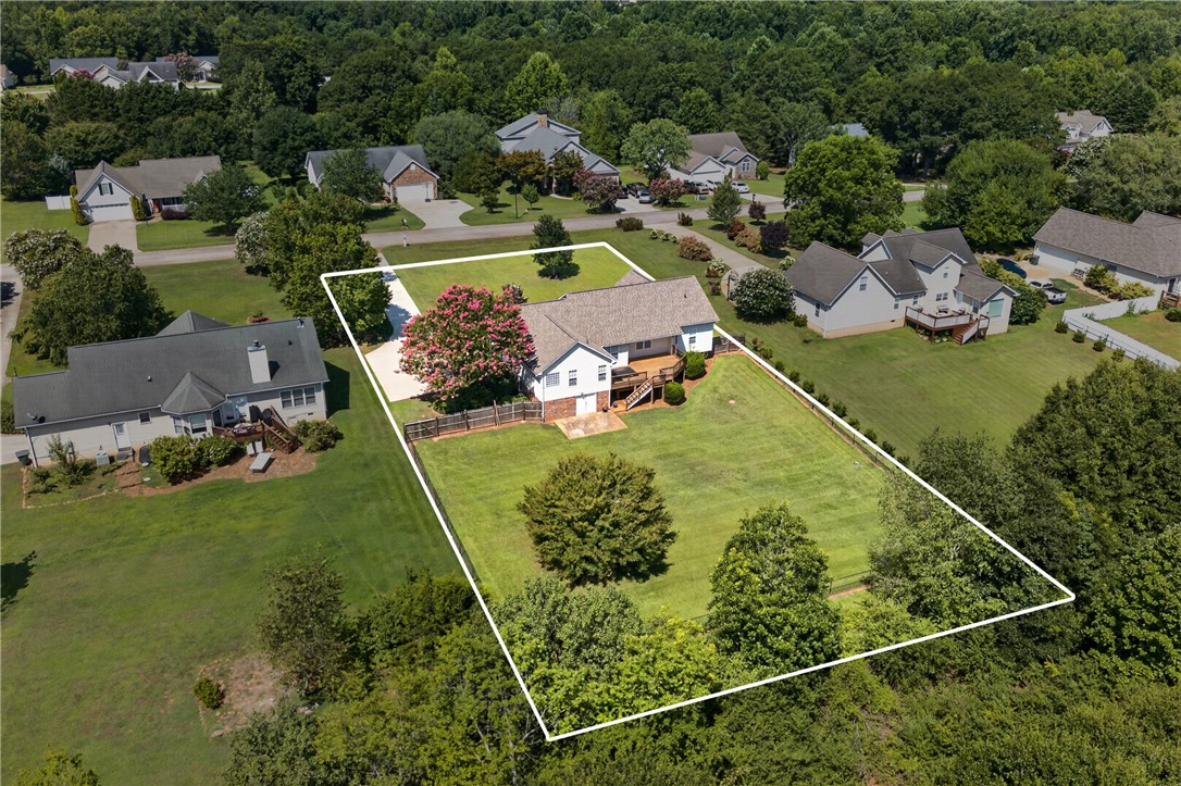 612 Providence Point Drive Seneca, SC 29678 - Photo 37 of 43 An aerial perspective showcases a well-maintained home with a generous lawn and ample outdoor space.