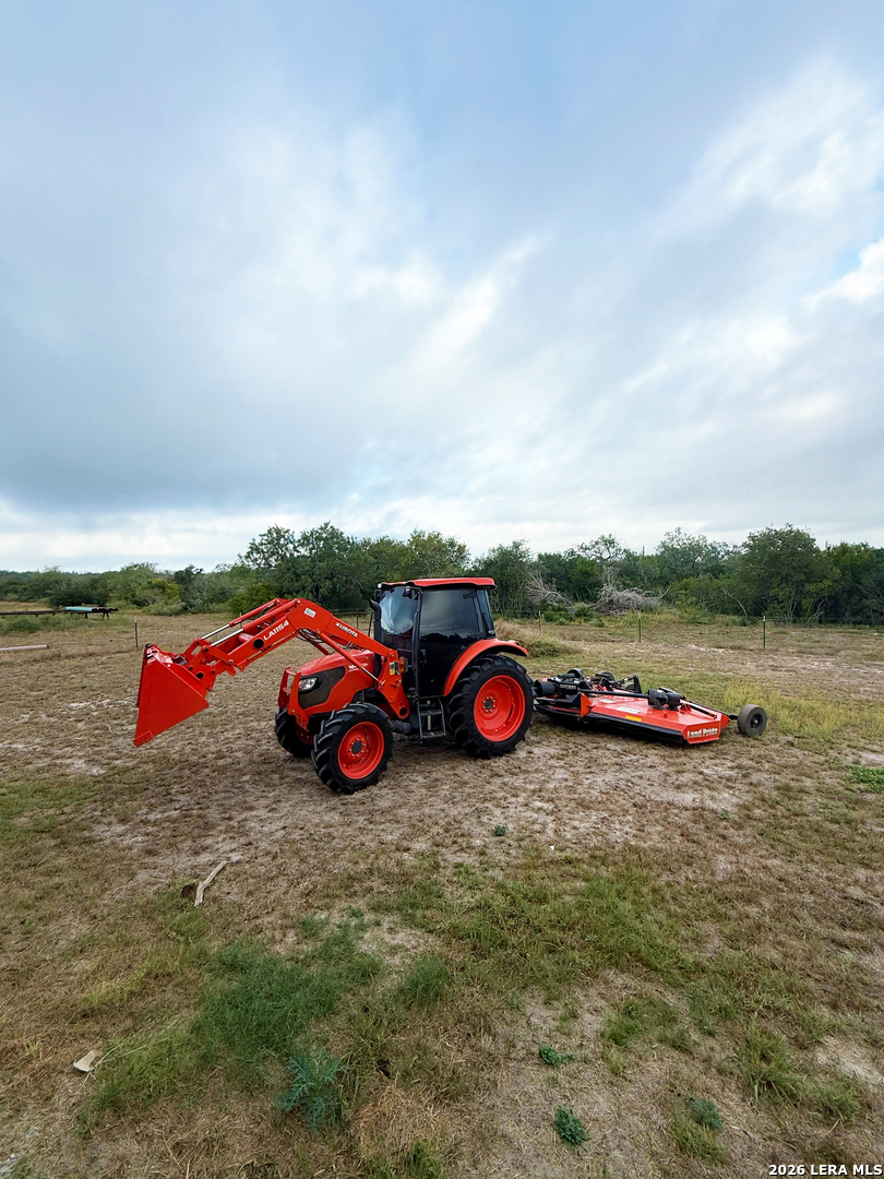 4552 Mineral Cemetery Road Beeville, TX 78102 - Photo 17 of 40 a view of a backyard with table and chairs