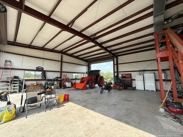 a view of a garage with a table and chairs