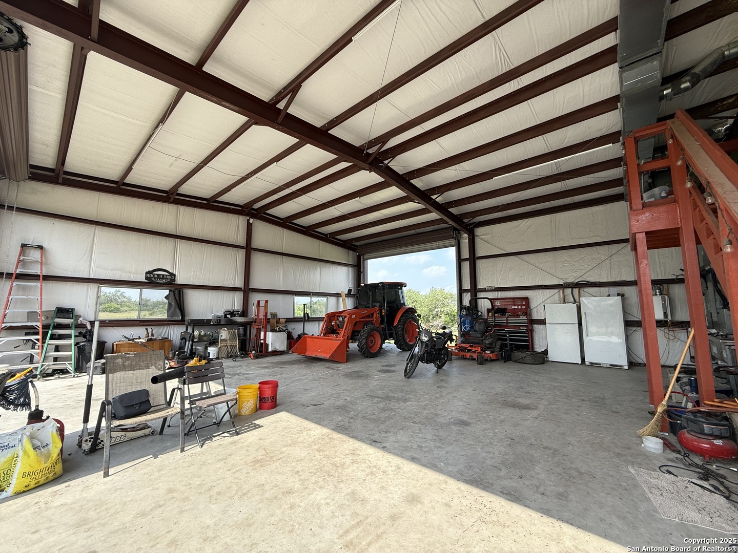 4552 Mineral Cemetery Road Beeville, TX 78102 - Photo 18 of 40 a view of a garage with a table and chairs