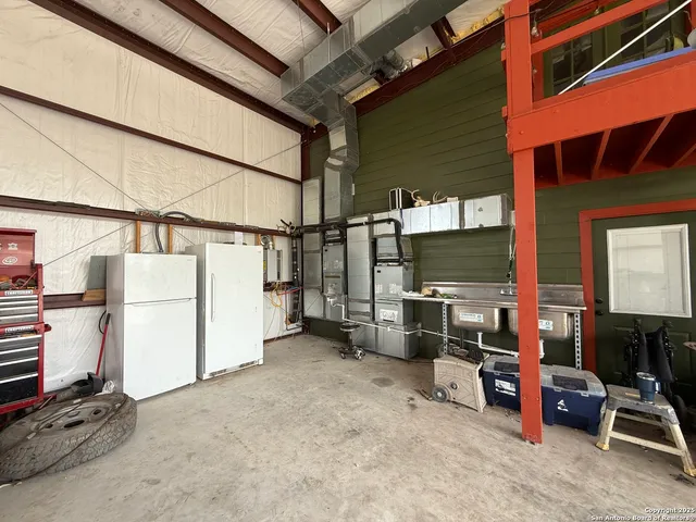 a view of a field with trees in background