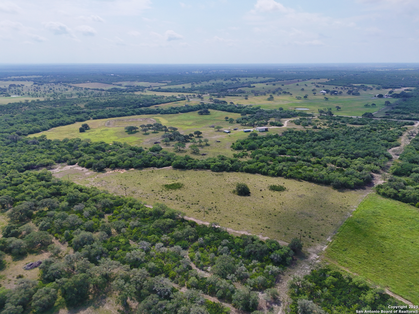 4552 Mineral Cemetery Road Beeville, TX 78102 - Photo 36 of 40 a view of a lake with a city