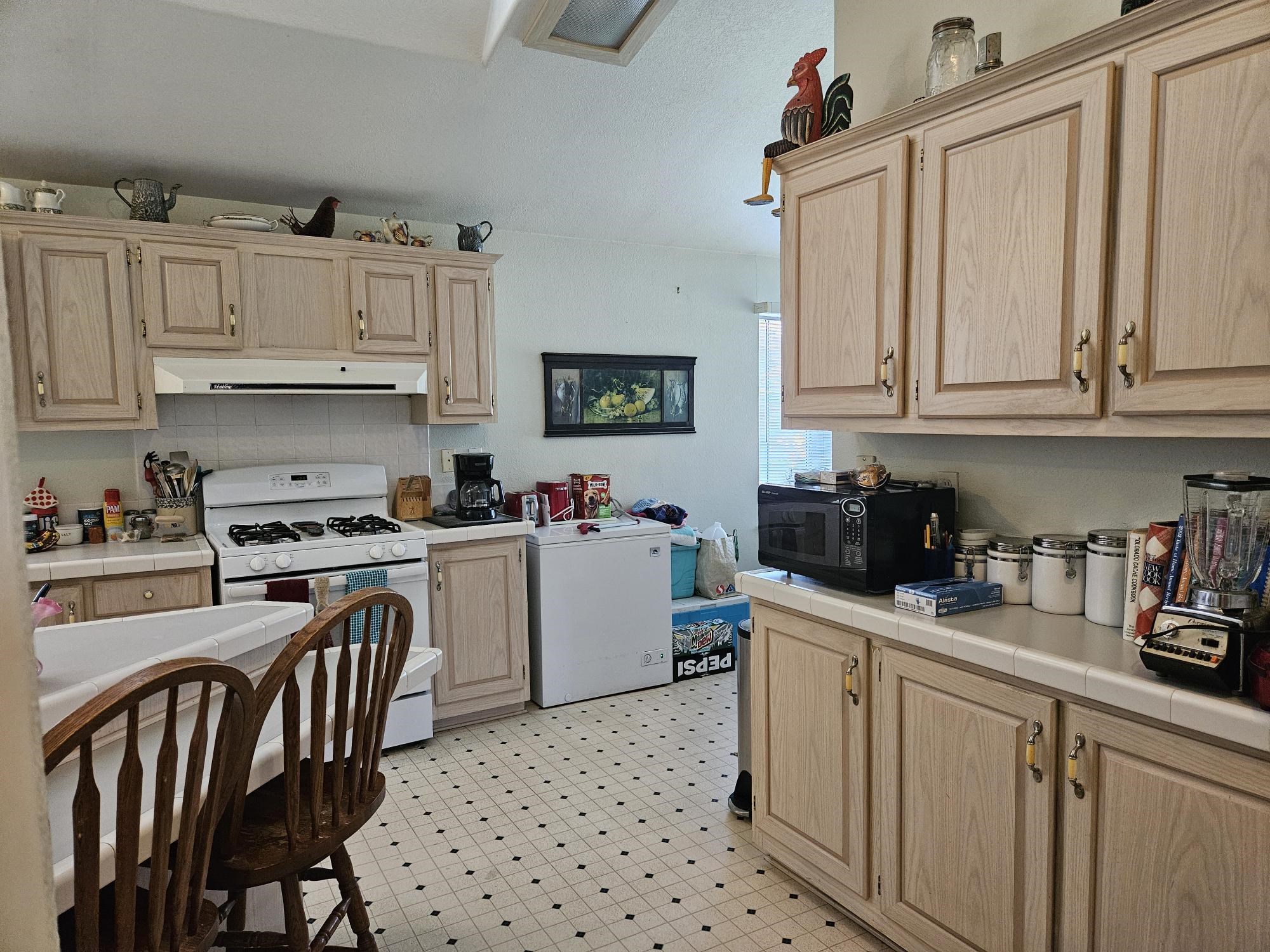 435 32 Road, Unit 424 Clifton, CO 81520 - Photo 11 of 21 a kitchen with a white cabinets and white appliances