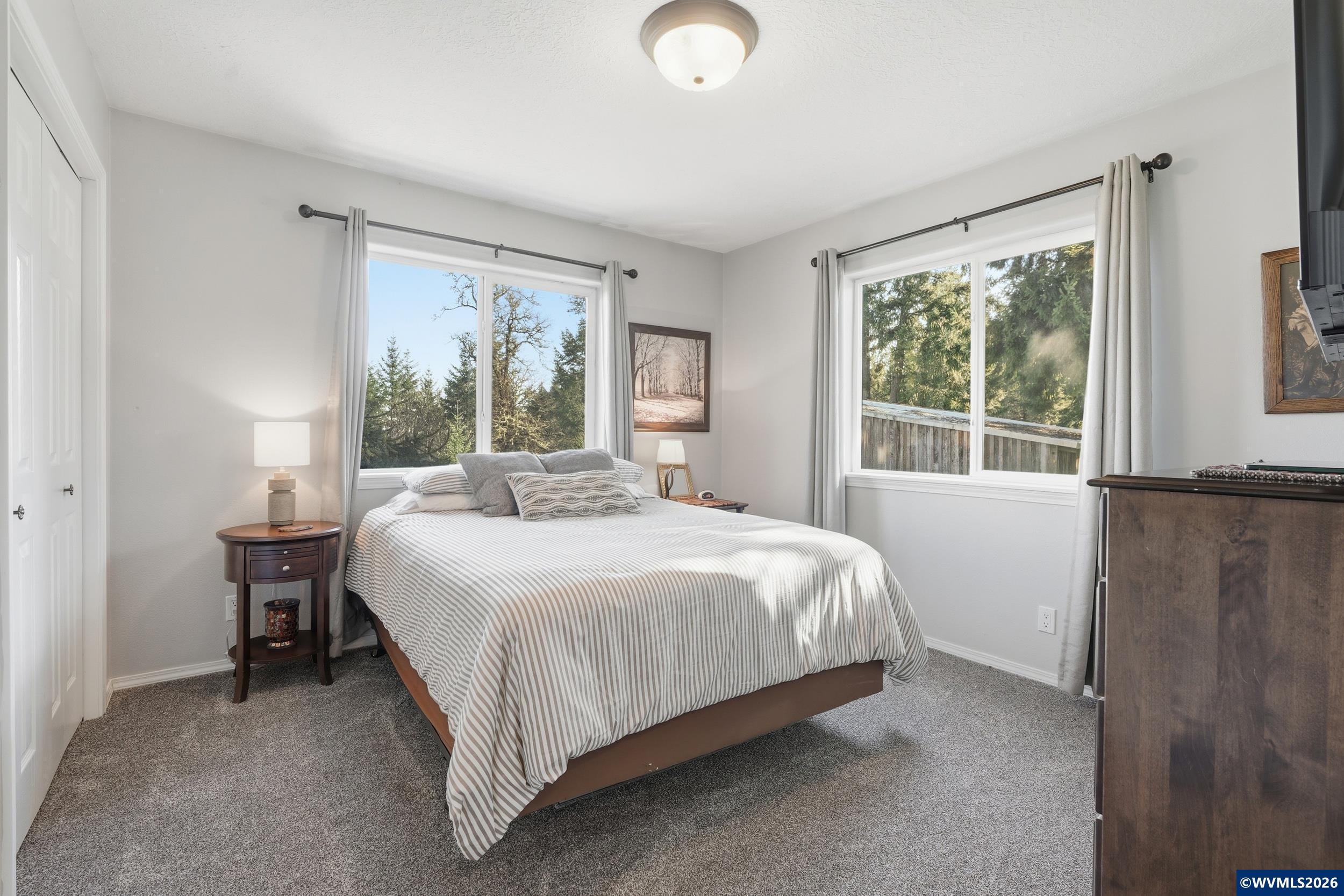 1110 Reuben Boise Road Dallas, OR 97338 - Photo 29 of 49 a bedroom with a bed and window